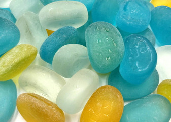 Beach Glass - Rounded Blue, Yellow & White Assorted Pebbles - (approx. 1 Kilogram/2.2 lbs. 1-1.5 inches). Multiple colored pebbles in a pile. Copyright 2025 SeaShellSupply.com.