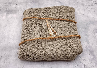 Fishing Net - Used (4 X 9 feet). One brown olive green fishing net that comes folded and banded. Copyright 2022 SeaShellSupply.com.