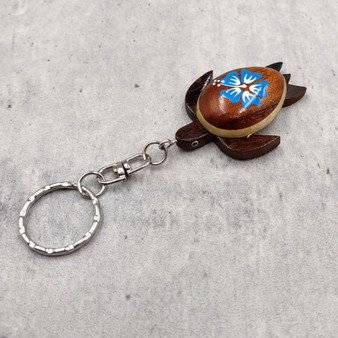 Blue Hibiscus Painted Wooden Sea Turtle Keychain (1 keychain approx. 4.25+ inches) Wooden Sea Turtle Key Fob for gifting or party favors! Copyright 2025 SeaShellSupply.com. Blue Hibiscus Painted Wooden Sea Turtle Keychain (1 keychain approx. 4.25+ inches) Wooden Sea Turtle Key Fob for gifting or party favors! Copyright 2025 SeaShellSupply.com.