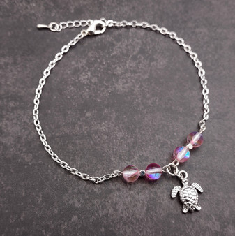 Sea Turtle Anklet Light Pink Beads Silver Color (approx. 9+ inches AROUND) Cute Pink Sea Turtle Charm Anklet for any beachy outfit! Copyright 2025 SeaShellSupply.com.