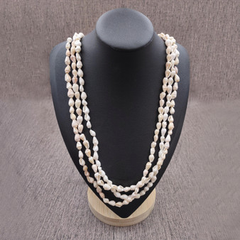 White Nassa Shell Leis (3 Leis Approx. .25 x 28 Inches). White little shells strung through string. Copyright 2026 SeaShellSupply.com.