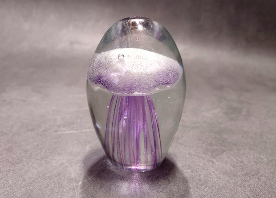 Jellyfish Glass Egg Purple Paperweight Glows (1 figurine approx. 3.5 in tall). Copyright 2025 SeaShellSupply.com.