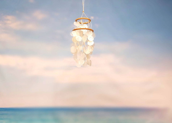 White Capiz Shell Wind Chime Chandelier (1 chime approx. 10 x 4 inches) Natural White Capiz Shell Wind Chime for coastal home décor! Copyright 2025 SeaShellSupply.com.