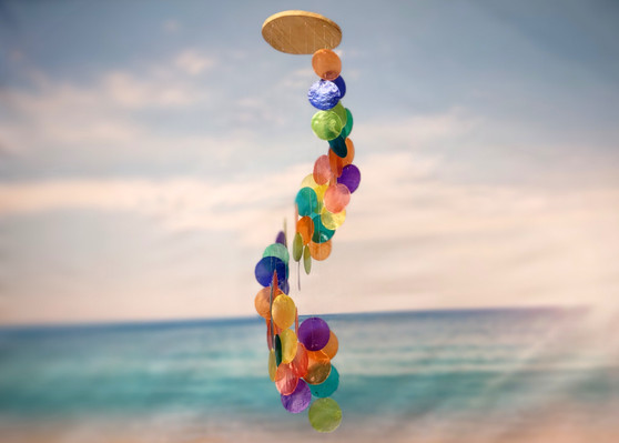 Rainbow Spiral Round Cut Capiz Wind Chime (1 chime approx. 25 x 5 inches) Colorful Capiz Shell Wind Chime adding coastal charm to any home! Copyright 2025 SeaShellSupply.com.