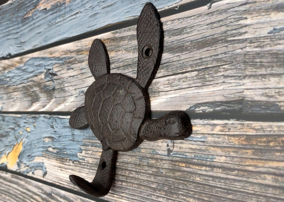 Dark Rust Cast Iron Sea Turtle Wall Hook (1 cast iron hook approx. 6+ inches) Dark Patina Sea Turtle Wall Hanger for coastal home decor! Copyright 2025 SeaShellSupply.com.