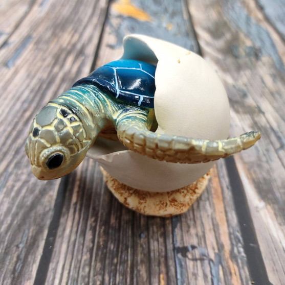 Blue Baby Sea Turtle Hatching Figure (1 turtle approx. 3+ inches) Blue Painted Resin Baby Turtle Egg Figure for coastal home décor! Copyright 2025 SeaShellSupply.com.