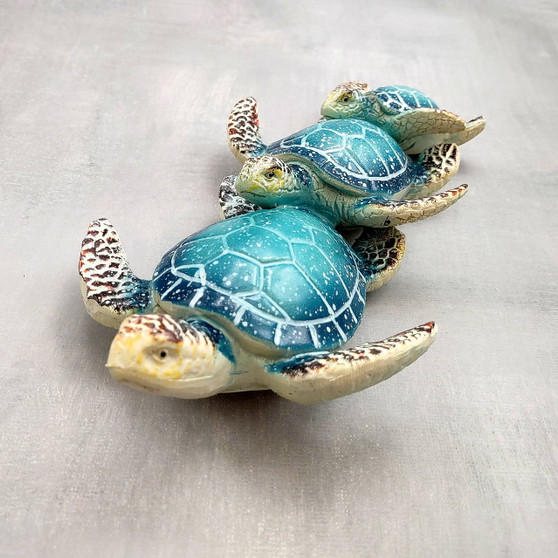 Blue Resin Sea Turtle Family Figurine (1 figurine approx. 8+ inches long) Blue Turtle Family Trio for coastal decor display and collecting! Copyright 2025 SeaShellSupply.com.\n