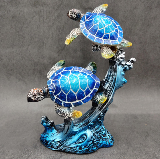 Two Blue Sea Turtles Swimming Sculpture (1 figurine approx. 7+ inches tall) Resin Sea Turtle Pair for coastal home decor & collectibles! Copyright 2025 SeaShellSupply.com.
