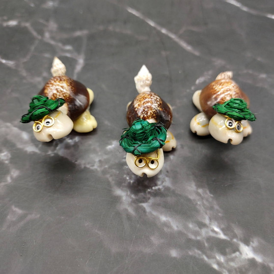 Cowrie Shell Sea Turtle Figurines Green Hat (3 figures approx. 2+ inches) Cute Cowrie Seashell Sea Turtles for gifts decor & display! Copyright 2025 SeaShellSupply.com