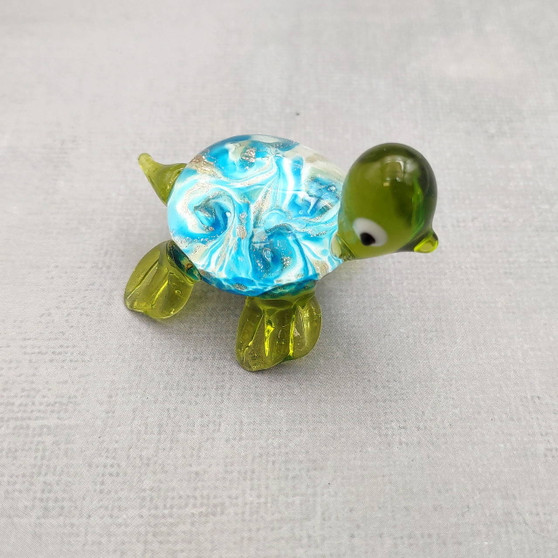 Swirl Glass Sea Turtle Figurine Green Blue (1 figure approx. 1.5 inches) Swirly Green Blue Glass Sea Turtle for gifts décor & collecting! Copyright 2025 SeaShellSupply.com.