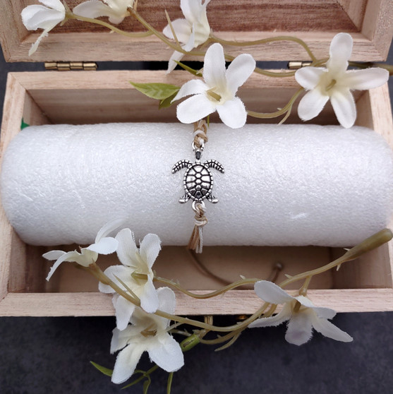 Sea Turtle Charm Bracelet Taupe Beige White Cord (approx. 5-7+ inches AROUND) Tan white Sea Turtle Cord Bracelet great for gifting! Copyright 2025 SeaShellSupply.com.