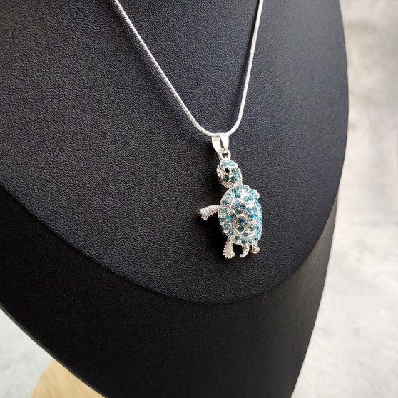 Aqua Rhinestone Sea Turtle Pendant Necklace (approx. 16+ inches AROUND) Teal Sea Turtle Jewelry a gift for ocean & sea turtle enthusiast! Copyright 2025 SeaShellSupply.com.