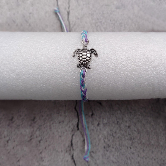 Sea Turtle Bracelet Braided Cord Light Blue Purple White (approx. 5-7+ inches AROUND) Blue Purple String Sea Turtle Bracelet to gift! Copyright 2025 SeaShellSupply.com.