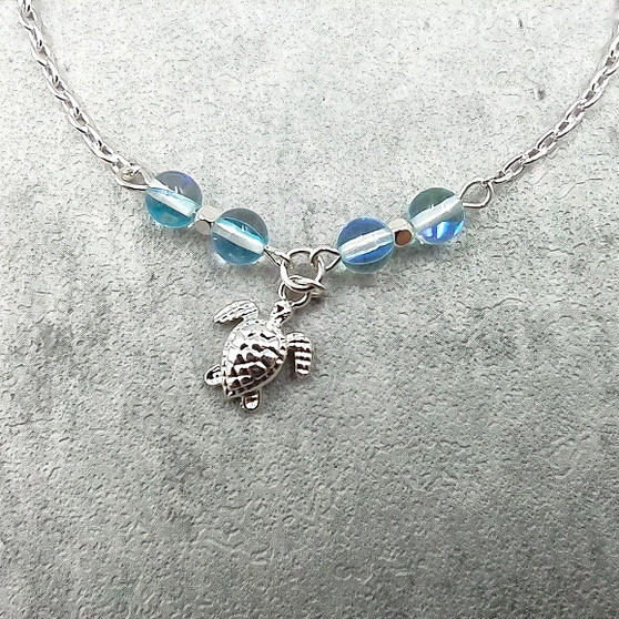 Sea Turtle Anklet Aqua Blue Beads Silver Color (approx. 9+ inches AROUND) Cute Blue Sea Turtle Charm Anklet for any beachy outfit! Copyright 2025 SeaShellSupply.com.