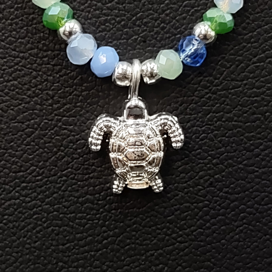 Sea Turtle Charm Necklace Blue Green White Beads Silver Color (approx. 14+ inches AROUND) Sea Turtle Necklace Jewelry for seaside wear! Copyright 2025 SeaShellSupply.com.