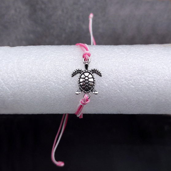 Sea Turtle Charm Bracelet Pink White Cord (approx. 5-7+ inches AROUND) Rose Carnation Sea Turtle String Bracelet Jewelry a thoughtful gift! Copyright 2025 SeaShellSupply.com.