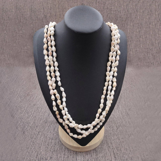 White Nassa Shell Leis (3 Leis Approx. .25 x 28 Inches). White little shells strung through string. Copyright 2026 SeaShellSupply.com.