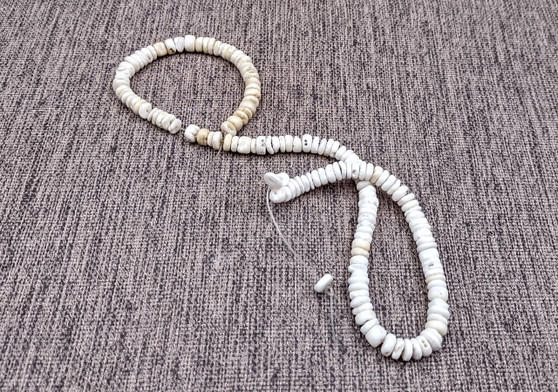 White Puka Style Seashells Drilled Strand (1 strand approx. 16 inches x 4-5+ mm) Copyright 2024 SeaShellSupply.com