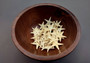 Mini Tan Starfish - Archaster Typicus - (approx. 45-50 starfish .5-1 inch). Multiple orange and tan starfish in a pile. Copyright 2025 SeaShellSupply.com