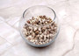 Nassarius Phyrrus Seashells - Red-banded Nassa (approx. 65-75 shells .5-.75 inches). Brown and white striped shells in a pile. Copyright 2022 SeaShellSupply.com.