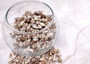 Nassarius Phyrrus Seashells - Red-banded Nassa (approx. 65-75 shells .5-.75 inches). Brown and white striped shells in a pile. Copyright 2022 SeaShellSupply.com.
