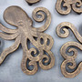 Octopus Trivet Cast Iron Bronze Brown Hot Pad (1 trivet approx. 7L x 6D x .75H inches) Brown Metal Octopus Trivet for dining table decor! Copyright 2026 SeaShellSupply.com.