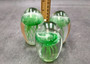 Jellyfish Glass Egg Dark Green Paperweight Glow In The Dark (1 figurine approx. 3.5 inches tall) Copyright 2025 SeaShellSupply.com.