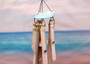 Hanging Wooden Fish Bamboo Windchime (1 Chime approx. 28 x 6.5 inches) Painted fish bamboo windchime brings beachside charm to any home! Copyright 2025 SeaShellSupply.com.