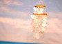 White Capiz Shell Wind Chime Chandelier (1 chime approx. 10 x 4 inches) Natural White Capiz Shell Wind Chime for coastal home décor! Copyright 2025 SeaShellSupply.com.