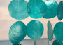 Turquoise Capiz Shell Flat Wind Chime (1 Chime approx. 13 x 16 inches) Turquoise Capiz Shell Flat Wind Chime for beachside home charm! Copyright 2025 SeaShellSupply.com.