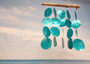 Turquoise Capiz Shell Flat Wind Chime (1 Chime approx. 13 x 16 inches) Turquoise Capiz Shell Flat Wind Chime for beachside home charm! Copyright 2025 SeaShellSupply.com.