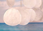 White Capiz Shell Flat Wind Chime (1 chime approx. 14 x 12 inches) Natural White Round Cut Capiz Shell Wind Chime for coastal home décor! Copyright 2025 SeaShellSupply.com.