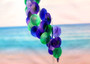 Purple Green Spiral Capiz Shell WInd Chime (1 Chime approx. 23 x 5 inches) Green Purple Capiz Wind Chime brings beachside charm to any home! Copyright 2025 SeaShellSupply.com.