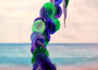 Purple Green Spiral Capiz Shell WInd Chime (1 Chime approx. 23 x 5 inches) Green Purple Capiz Wind Chime brings beachside charm to any home! Copyright 2025 SeaShellSupply.com.