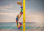 Rainbow Spiral Round Cut Capiz Wind Chime (1 chime approx. 25 x 5 inches) Colorful Capiz Shell Wind Chime adding coastal charm to any home! Copyright 2025 SeaShellSupply.com.
