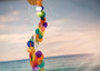 Rainbow Spiral Round Cut Capiz Wind Chime (1 chime approx. 25 x 5 inches) Colorful Capiz Shell Wind Chime adding coastal charm to any home! Copyright 2025 SeaShellSupply.com.