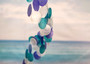 Spiral Blue Turquoise White Capiz Wind Chime (1 chime approx. 26 x 5.5 inches) Colorful Spiral Capiz Shell Chime for coastal home decor! Copyright 2025 SeaShellSupply.com.
