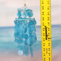 Turquoise Capiz Shell Wind Chime Chandelier (1 Chime approx. 10 x 5 inches) Turquoise Capiz Shell Wind Chime for beachside home charm! Copyright 2026 SeaShellSupply.com.
