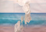 Circle White Spiral Stairway Capiz Shell WInd Chime (1 Chime approx. 31 x 5.5 inches) White Spiral Chime brings beachside charm to any home! Copyright 2025 SeaShellSupply.com.