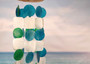 Aqua White Green Capiz Wind Chime (1 chime approx. 18 x 5.5 inches) Circle Square White Aqua Capiz Wind Chime for coastal home decoration! Copyright 2025 SeaShellSupply.com.