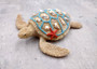 Sandy Sea Turtle Figure With Seashells Net Starfish (1 turtle approx. 5+ inches) Sand Texture Resin Cast Sea Turtle Figure for home decor! Copyright 2025 SeaShellSupply.com.