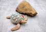 Sandy Sea Turtle Figure With Seashells Net Starfish (1 turtle approx. 5+ inches) Sand Texture Resin Cast Sea Turtle Figure for home decor! Copyright 2025 SeaShellSupply.com.