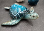 Blue Sea Turtle Figurine Painted Resin (1 turtle approx. 5+ inches long) Blue Painted Resin Sea Turtle Figure for coastal home decor! Copyright 2025 SeaShellSupply.com.