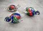 Red Green Blue Glass Sea Turtle Figurine (1 figure approx. 4.5+ inches long) Colorful Glass Sea Turtle for coastal cottage décor charm! Copyright 2025 SeaShellSupply.com.