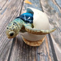 Blue Baby Sea Turtle Hatching Figure (1 turtle approx. 3+ inches) Blue Painted Resin Baby Turtle Egg Figure for coastal home décor! Copyright 2025 SeaShellSupply.com.