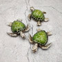 Silver Green Sea Turtle Resin Painted Figurine (1 turtle approx. 3+ inches) Resin Silver Green Sea Turtle Figure for gifting & display! Copyright 2025 SeaShellSupply.com.