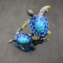 Two Blue Sea Turtles Swimming Sculpture (1 figurine approx. 7+ inches tall) Resin Sea Turtle Pair for coastal home decor & collectibles! Copyright 2025 SeaShellSupply.com.