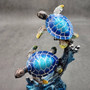 Two Blue Sea Turtles Swimming Sculpture (1 figurine approx. 7+ inches tall) Resin Sea Turtle Pair for coastal home decor & collectibles! Copyright 2025 SeaShellSupply.com.