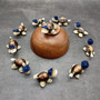 Cowrie Shell Sea Turtle Figurines Dark Blue Hat (3 figures approx. 2+ inches) Cute Cowrie Seashell Sea Turtles for gifts decor & display! Copyright 2025 SeaShellSupply.com Cowrie Shell Sea Turtle Figurines Dark Blue Hat (3 figures approx. 2+ inches) Cute Cowrie Seashell Sea Turtles for gifts decor & display! Copyright 2025 SeaShellSupply.com