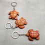 Handmade Koa Wood Sea Turtle Keychain (1 keychain approx. 2.5+ inches) Wooden Sea Turtle Keychain for gifting or decorative charm! Copyright 2025 SeaShellSupply.com